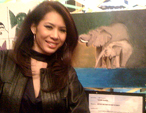 Miss Vachini Krairiksh and her painting